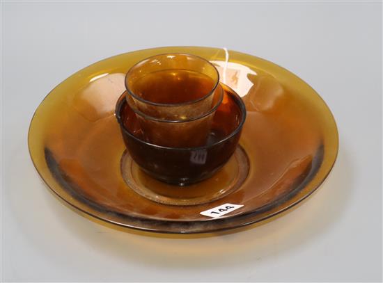 Beijing amber glass: a dish, a bowl and two cups, 19th/20th century largest diameter 27cm (4)